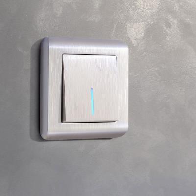 Фото Выключатель одноклавишный проходной с подсветкой перла Werkel W1112113мутровый рифленый